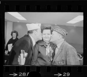 John Richard Hicks - Goodbye kisses from American Legion Cmdr. Leo Barry, left, and VFW Cmdr. Richard Lawler send Rep. Louise Day Hicks off to Vietnam
