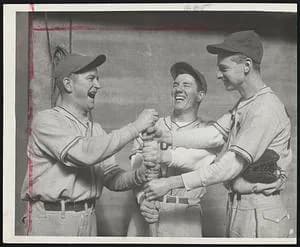George Minot - Off the a Roaring Start- Tufts College, baseball Coach John "Jit" Ricker (left) Outfielder Rudy Fobert (center) and First Baseman George Minot seem to be uproariously happy as they choo