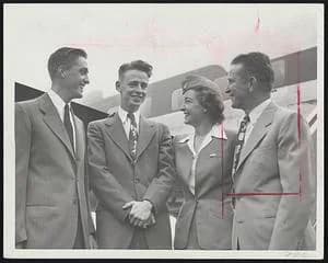 George Minot - Off For N.C.A.A Playoffs- Coach John "Jit" Ricker (right), of the NCAA-bound Tufts College baseball team, introduces Stewardess Elinor Armstrong of Medford to Pitcher Seymour "Bud" Nile