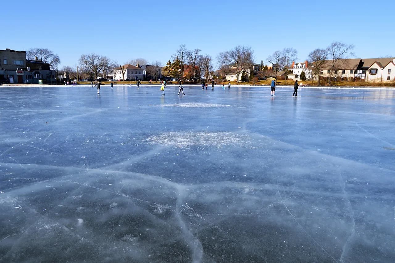 William Alfred Fowler — lake, frozen, ice, ice skating, skating, water, outdoors, country, oconomowoc, wisconsin, lake country, winter, fun, activity, recreation, downtown, center, lake fowler, fowler, tourism, nature, sky, people