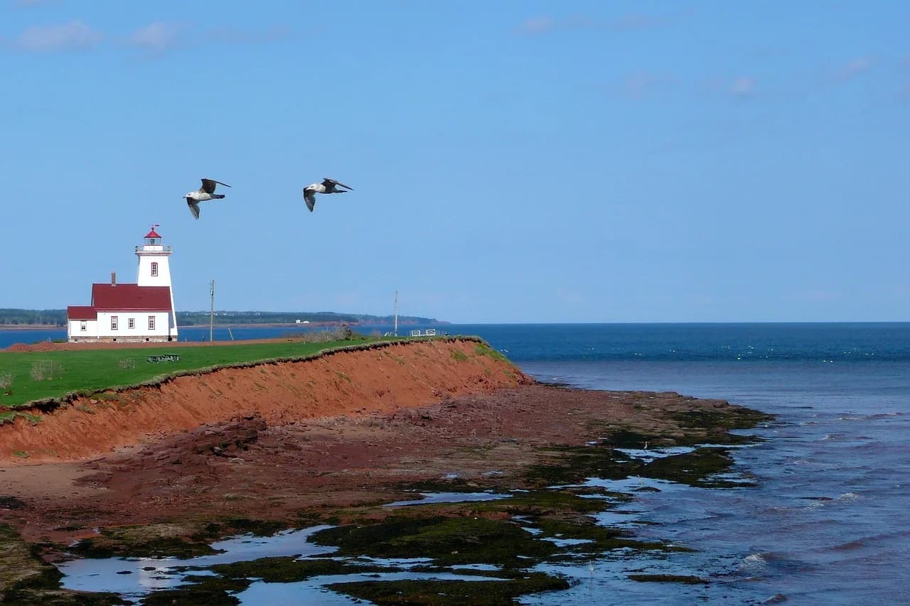Edward Sapir — prince edward island, canada, lighthouse, red shoreline, water, landscape, scenery, nature, blue island