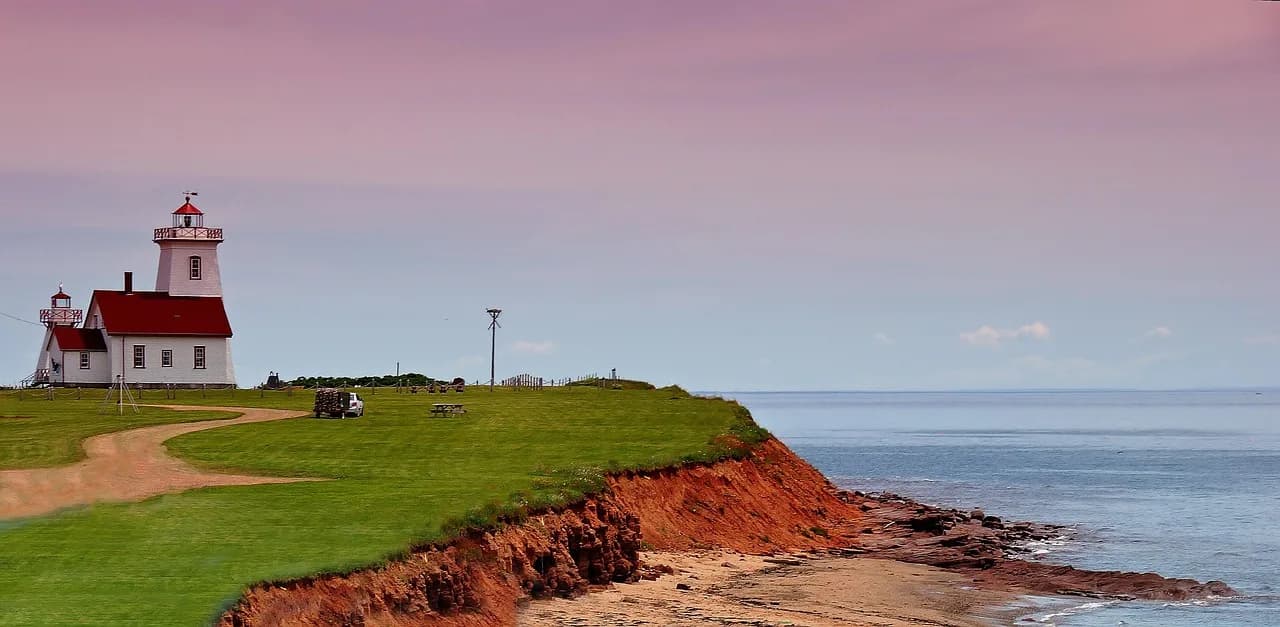 Edward Sapir — lighthouse, prince edward island, coast, field, building, coastline, sea, ocean, scenery, nature, horizon, sky, dusk, dawn, scenic