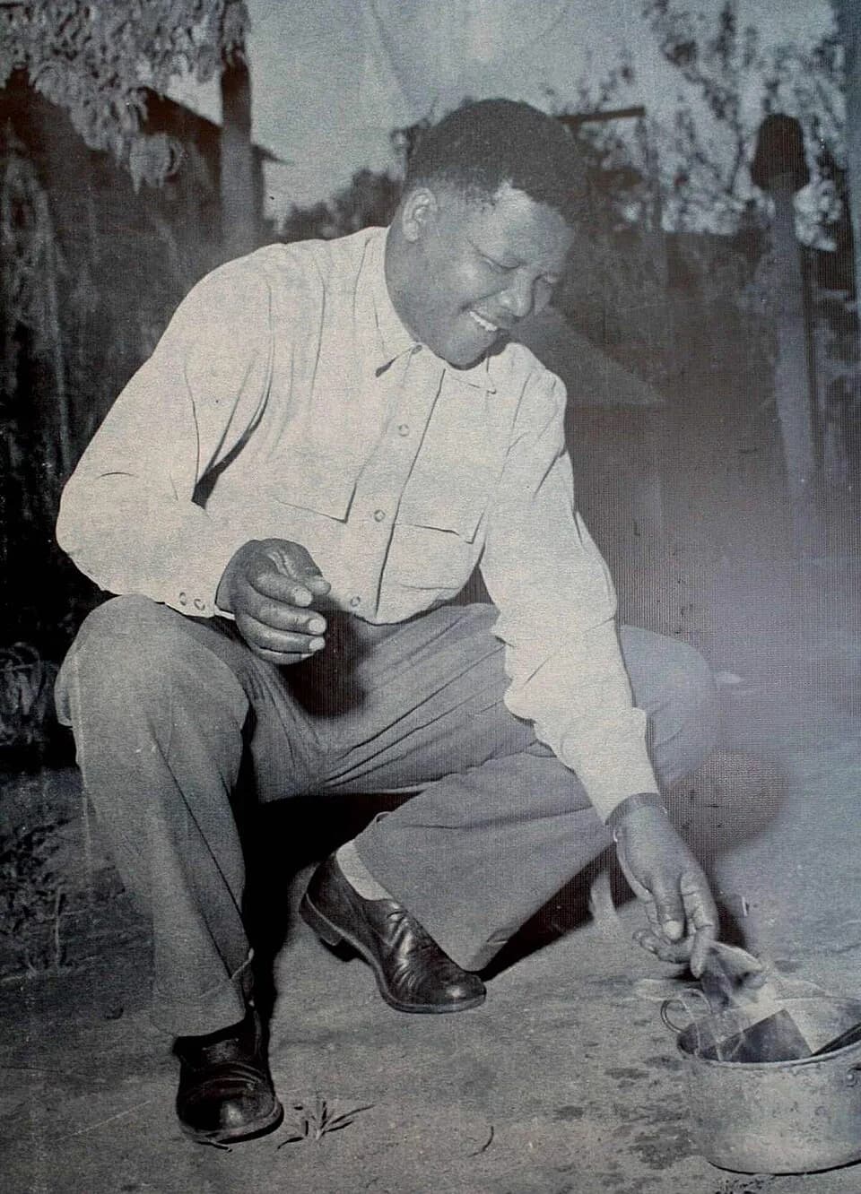 Nelson Mandela - Nelson Mandela burning the pass that all black South Africans were required to carry under the apartheid regime. This was a political act of defiance and carried out in front of press