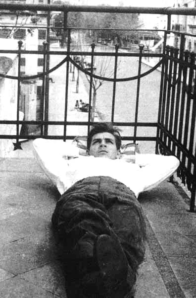 Che Guevara - A 20 year old Ernesto Guevara lying contemplatively on the balcony of his family's new home on Calle Araoz in Buenos Aires, Argentina.