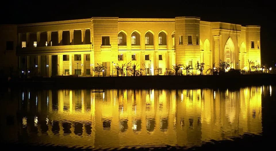 Saddam Hussein - I took the picture while I was stationed at Camp Victory, from Jan 2005-Jan 2006. Image is of the Al Faw Palace illuminated during the Change of Command ceremony in early Feb, 2005, b