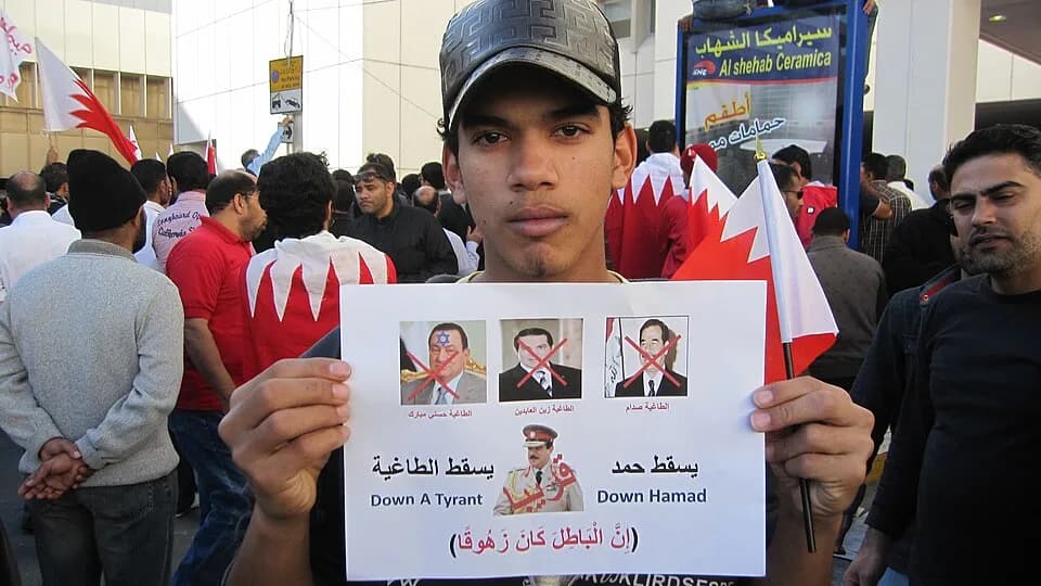 Saddam Hussein - An anti-government sign compares Bahrain's King Hamad to deposed dictators Hosni Mubarak of Egypt, ZIne El Abidine Ben Ali of Tunisia, and Saddam Hussein of Iraq.