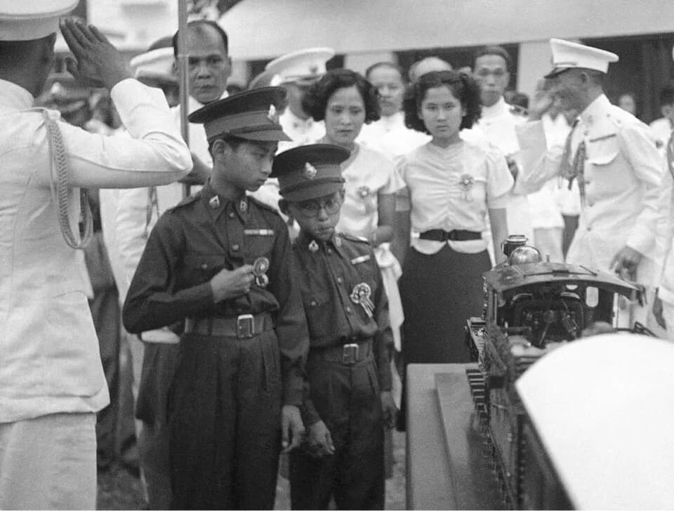 Bhumibol Adulyadej - In this Dec. 16, 1938, file photo, thirteen-year-old King Ananda of Siam, now known as Thailand, left, and his brother Prince Bhumibol, right, inspect a model train presented to h