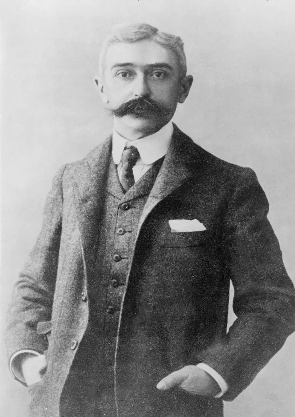 Pierre de Coubertin - Baron Pierre de Coubertin, half-length portrait, standing, facing front