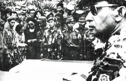 Suharto Suharto - Photo of then-Maj. Gen. Suharto of Indonesia attending funeral of five generals slain in 30 September movement.