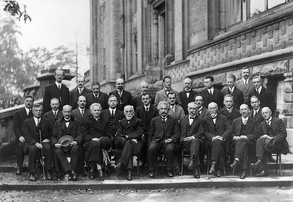 Max Born - 1927 Solvay Conference on Quantum Mechanics. Photograph by Benjamin Couprie, Institut International de Physique Solvay, Brussels, Belgium.
From back to front and from left to right :
August