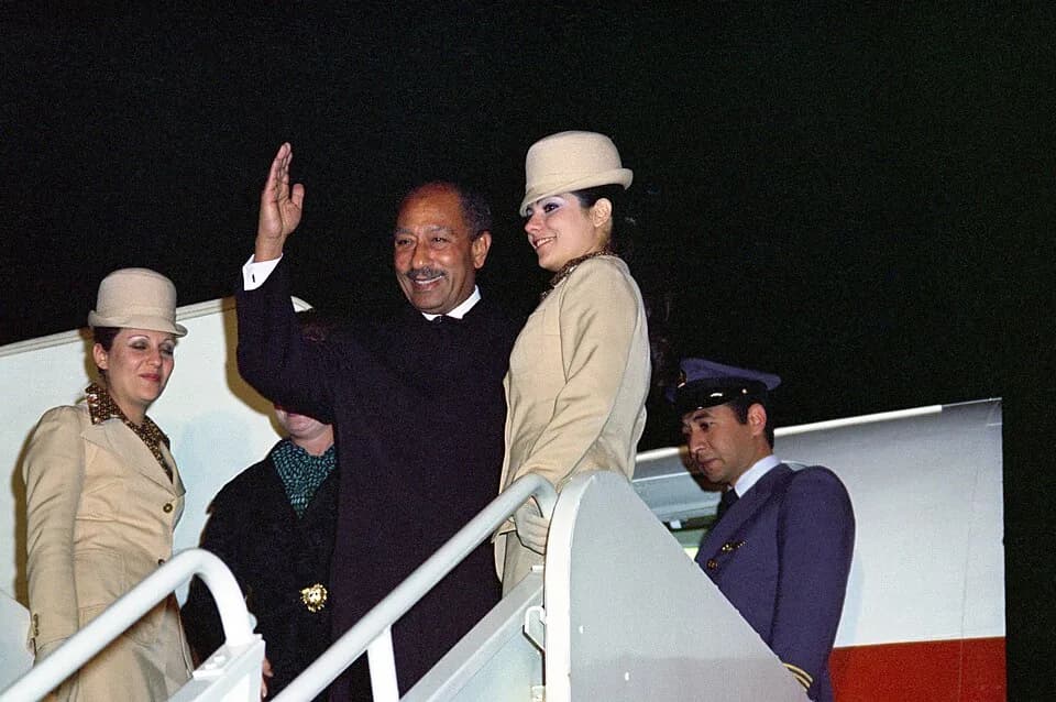 Anwar Sadat - Egyptian President Anwar el-Sadat waves as he departs from a state visit to the US.