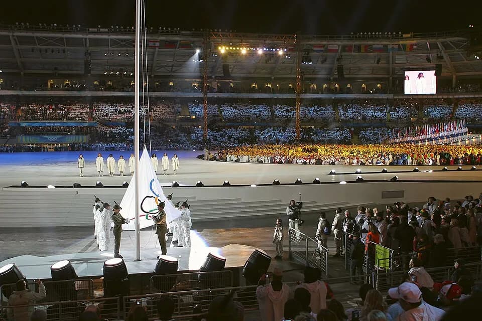 Wangari Muta Maathai - The Olympic flag is raised. The flag was brought into the stadium by Sophia Loren, Isabel Allende, Nawal El Moutawakel, Susan Sarandon, Wangari Maathai, Manuela Di Centa, Maria 