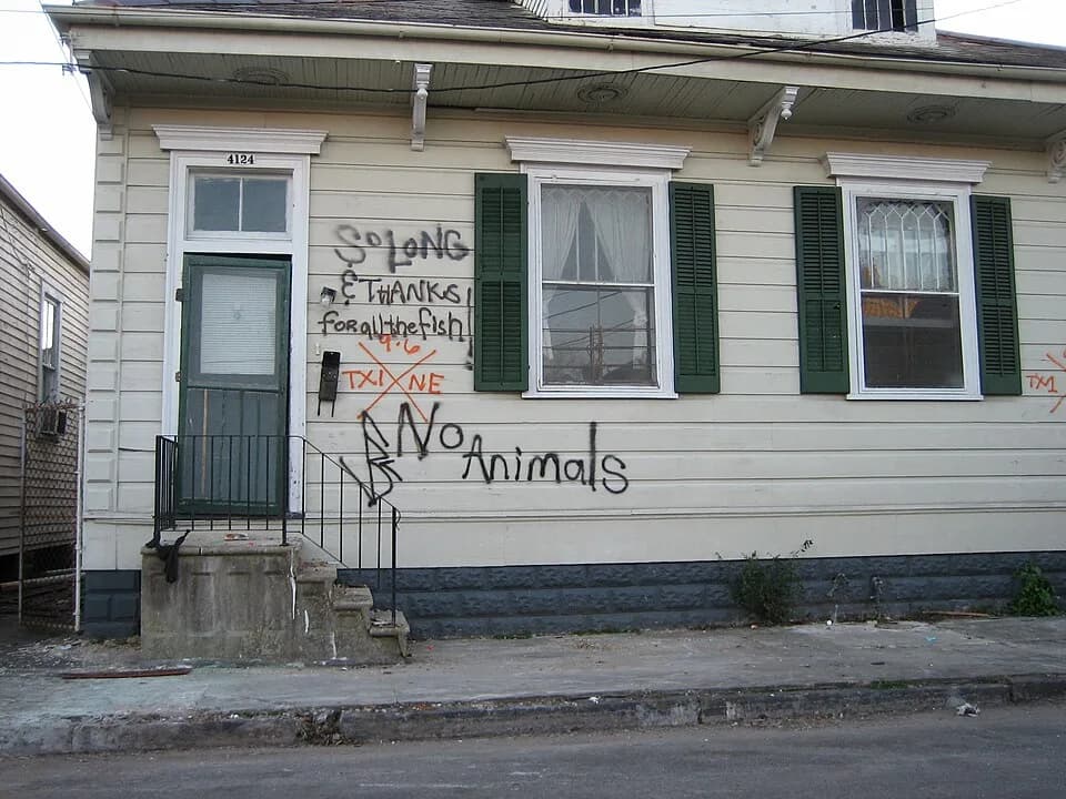 Douglas Adams - New Orleans after Hurricane Katrina : house in Marigny neighborhood, with "Hitchhiker's Guide to the Galaxy" related grafftiti.
Photo by Infrogmation, 4 February 2006
