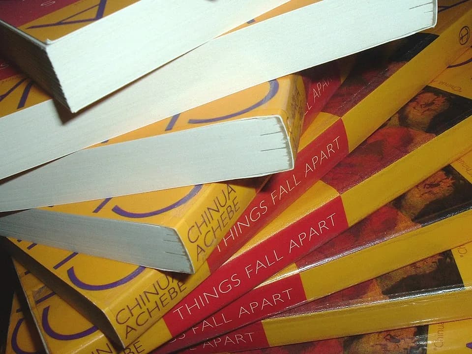 Chinua Achebe - A spiral stack of copies of the 1994 Anchor Books edition of Chinua Achebe's novel Things Fall Apart