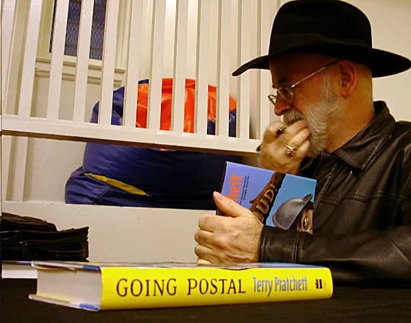 Terry Pratchett - I hate the striped background with the stupid brightly colored beanbag chair looking on, but you don't really get to pose people - you're kind of nervous to go in there and take pict