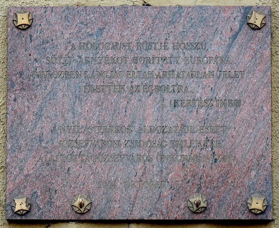 Imre Kertész - Commemorative plaque to the Jewish martyrs of Józsefváros (Budapest) with an Imre Kertész's poetic quote: „The smoke of the Holocaust clothed Europe in a long black shadow while his fla