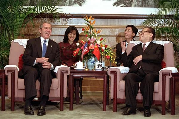 Jiang Zemin - President George W. Bush and Chinese President Jiang Zemin talk during an arrival ceremony at The Great Hall of the People in Beijing, People's Republic of China, Feb. 21.