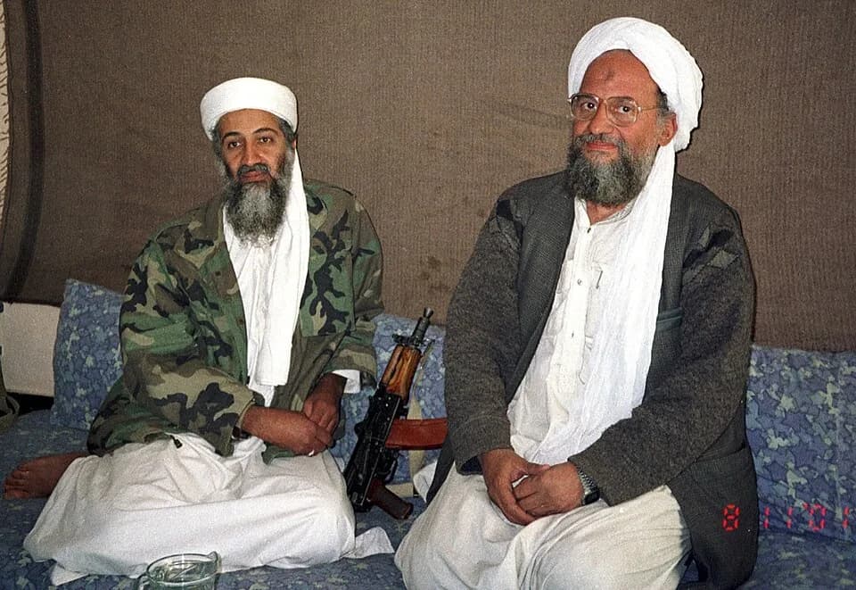 Ayman al-Zawahiri - Osama bin Laden sits with his adviser Ayman al-Zawahiri during an interview with Pakistani journalist Hamid Mir. Hamid Mir took this picture during his third and last interview wit