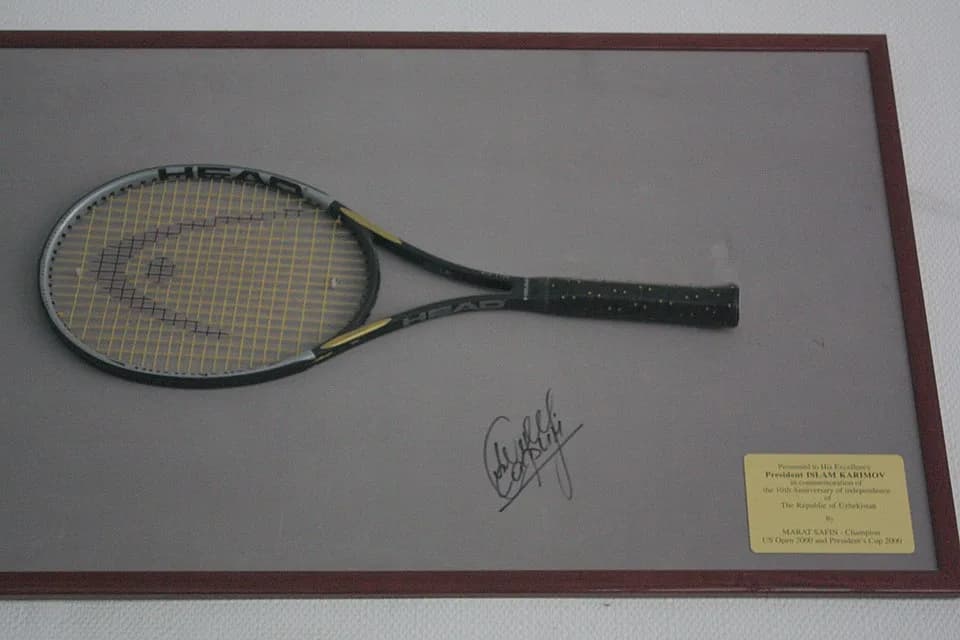 Islam Karimov - Head racquets and signature of Marat Safin, given to Uzbek president Islam Karimov for the 10th anniversary of the independance of Uzbekistan. Racquet exhibited in the Museum of Olympi