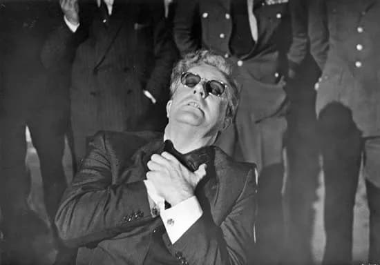 Peter Sellers - Dr. Strangelove trying to resist his alien hand.