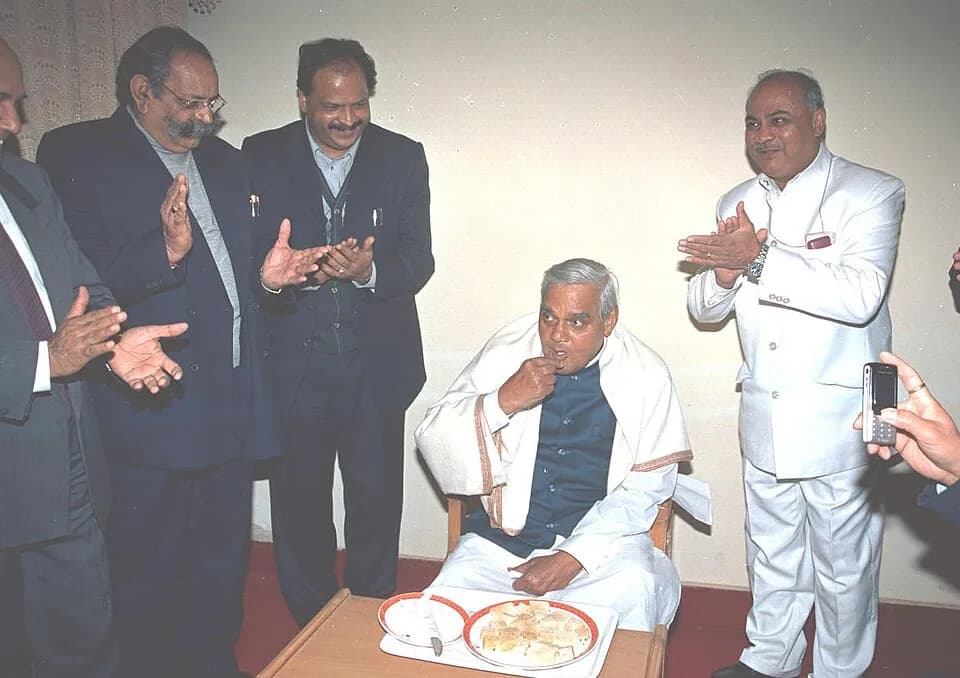 Atal Bihari Vajpayee - The Prime Minister Shri Atal Bihari Vajpayee having sweets on his 79th birthday at Bahror (Rajasthan) during the midnight of 24th and 25th December 2003.
 The Prime Minister tra