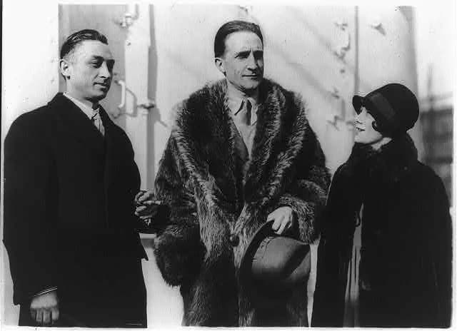 Marcel Duchamp - French artist Marcel Duchamp (1887-1968) in between Leon Hartt and Mrs. Hartt