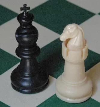 José Raúl Capablanca - New pieces for Capablanca chess (the Archbishop and Chancellor), designed by Matt Hucke 2004, built from readily available plastic standard pieces using handheld cutting tool an