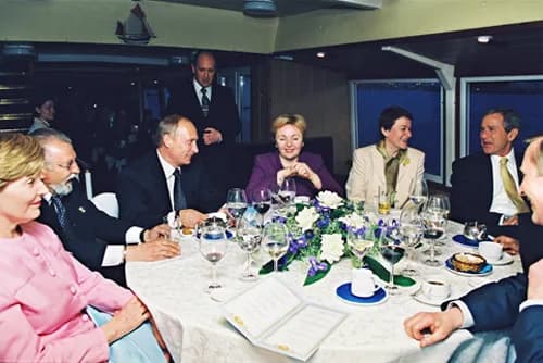 Yevgeny Prigozhin - ST PETERSBURG. President Putin and President Bush with their spouses on board the SS New Island.