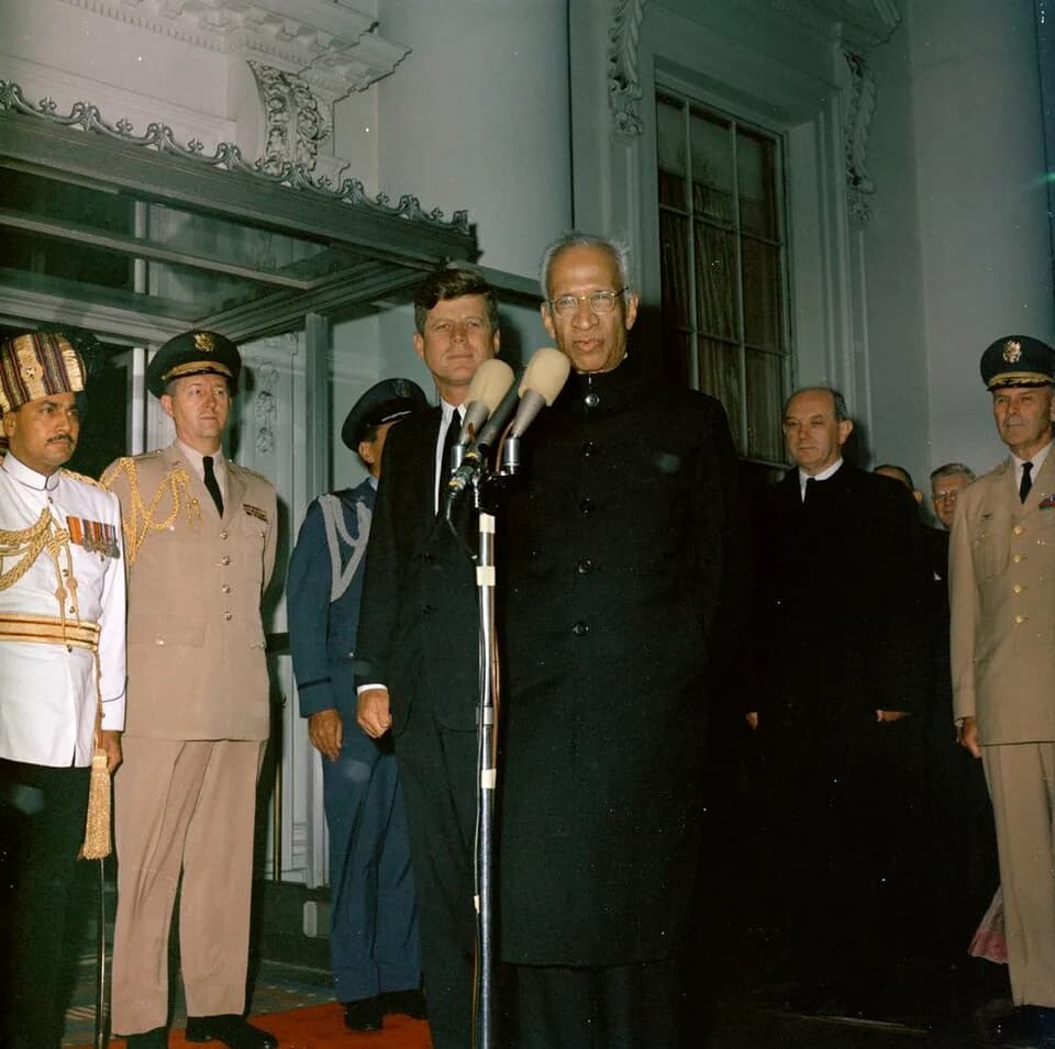 Sarvepalli Radhakrishnan - President Dr. Sarvepalli Radhakrishnan of India speaks at arrival ceremonies in his honor. Left to right: unidentified Indian military aide; Military Aide to President Kenne
