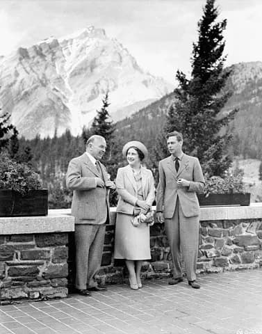 Queen Elizabeth the Queen Mother - King George VI and Queen Elizabeth talking with Rt. Hon. W.L. Mackenzie King on the terrace of the Banff Springs Hotel.