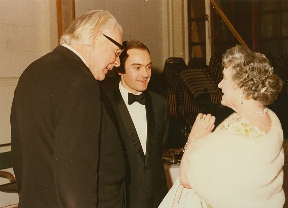 Queen Elizabeth the Queen Mother - 19 February 1974. Left to right: Lord Robbins, Peter Palumbo, and HM Queen Mother during the Library Appeal concert at Banqueting House.