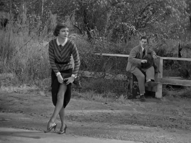 Claudette Colbert - Cropped screenshot of Claudette Colbert and Clark Gable from the trailer for the film It Happened One Night. Colbert's costume is by costume designer Robert Kalloch.