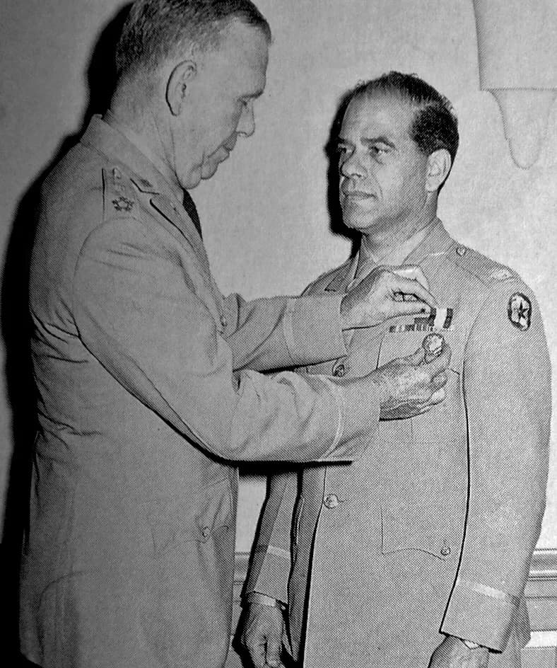 Frank Capra - Photo of Frank Capra receiving the Distinguished Service Medal from U.S. Army Chief of Staff General George C. Marshall