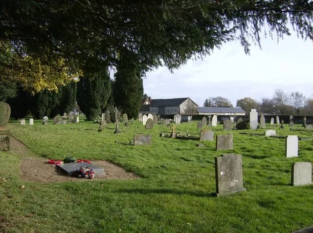 Bernard Montgomery - Binsted churchyard. A footpath enters Binsted churchyard from the west, in the north-western part of the square.  Beyond are the buildings of Roxford's House.  The prominent grave