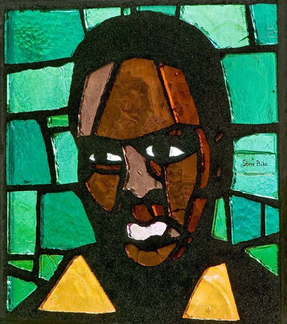 Steve Biko - Steve Biko. Stained glass window by Daan Wildschut in the Saint Anna Church, Heerlen (the Netherlands), ca. 1976. One of 12 modern saints and martyrs.