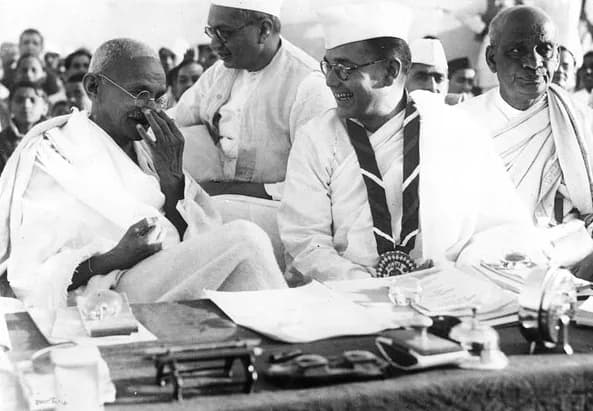 Sardar Vallabhbhai Patel - Gandhi at the Indian National Congress annual meeting in Haripura in 1938. Congress President Subhas Chandra Bose is wearing the ribbon, seated behind him is Dr. Rajendra Pr