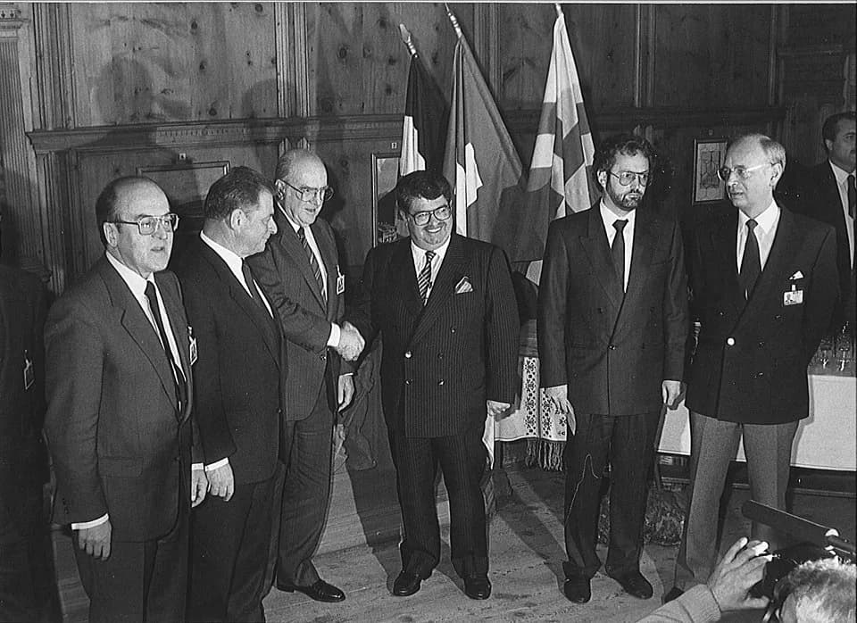 Turgut Özal - DAVOS/SWITZERLAND, 31 JAN 1988 - The Davos Declaration, a historic handshake between the Turkish and Greek Prime Ministers. (fltr) Kurt Furgler, Chairman of the Annual Meeting; Jean-Pasc