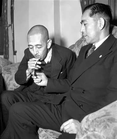 Eisaku Satō - Nobusuke Kishi (1896–1987, left) relaxes at the house of his brother, then-the-Chief-Cabinet-Secretary Eisaku Satō (1901–75), shortly after he was released from the Sugamo Prison on 24 D