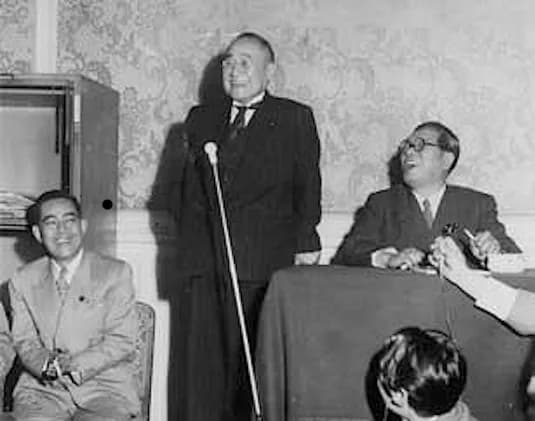 Eisaku Satō - From left: Rep. Eisaku Satō (Minister of Construction), Rep. Shigeru Yoshida (Prime Minister), Rep. Saeki Ozawa (Party Chairman). At a Liberal Party meeting, 1953.
