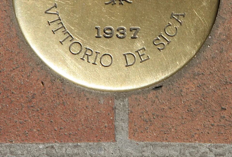 Vittorio De Sica - Italy, Tuscany, Montecatini Terme, Viale Verdi. The circular brass plate placed along Viale Verdi to remember the celebrities who stayed in town. The commemorative inscription repor