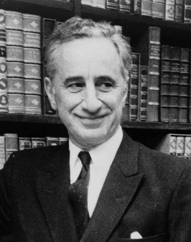 Elia Kazan - Elia Kazan, full-length portrait, standing before bookshelves at Brentano's book store  / World Journal Tribune photo by James Kavallines.
