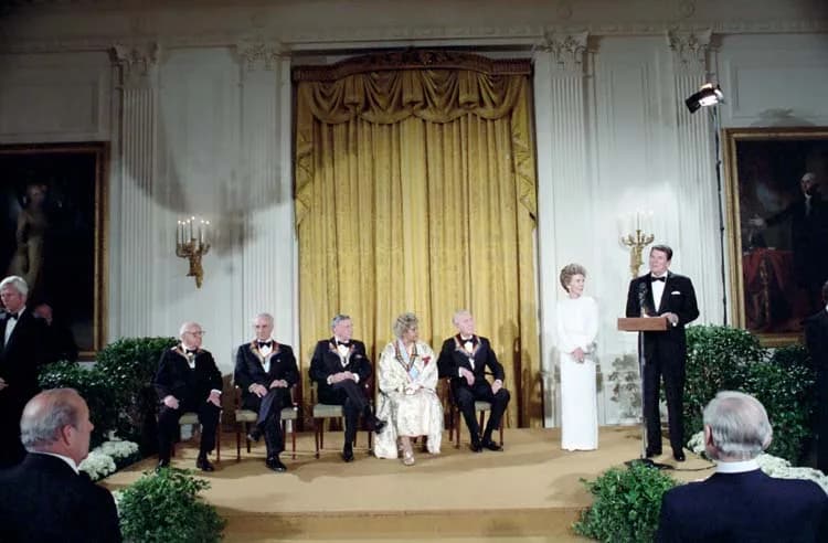 Elia Kazan - December 4, 1983: President Reagan makes remarks to the crowd as Nancy Reagan, Frank Sinatra, James Stewart, Virgil Thompson, and Elia Kazan look on in the East Room during Reception in H