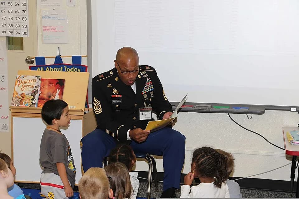 Bob Hope - U.S. Army Command Sgt. Maj. Shelton R. Williamson, left, the senior enlisted adviser for the 10th Regional Support Group, reads the book, The Amazing Turkey Rescue," to kindergarten studen