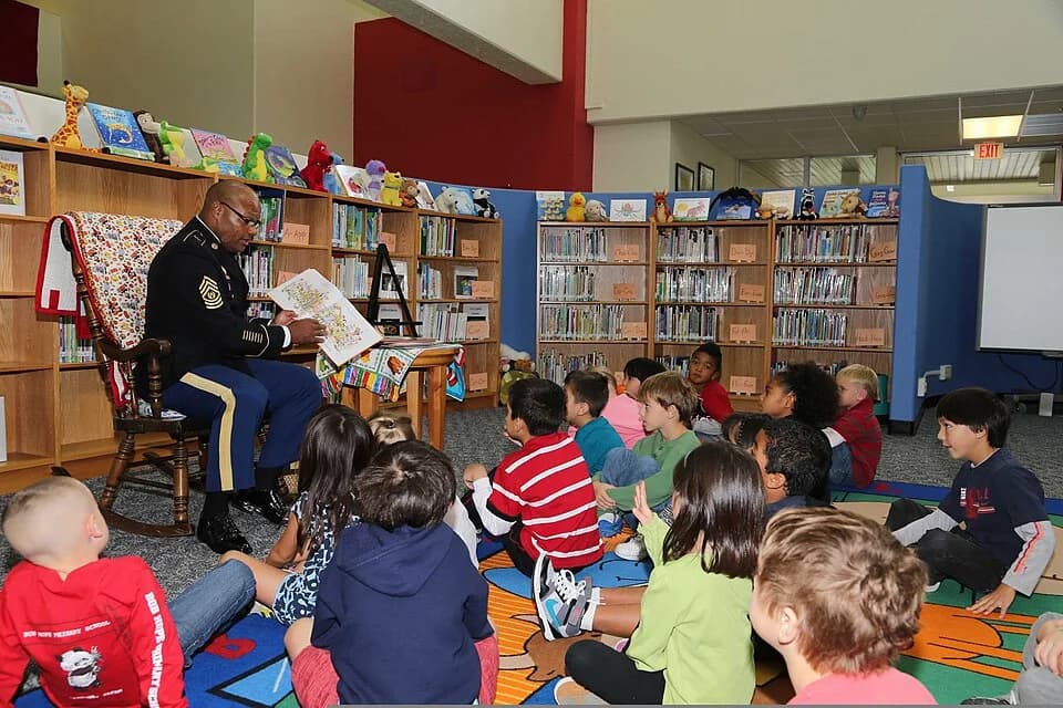 Bob Hope - U.S. Army Command Sgt. Maj. Shelton R. Williamson, left, the senior enlisted adviser for the 10th Regional Support Group, reads the book, Thanksgiving Is Here," to a first grade class duri