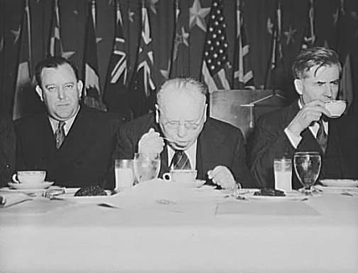 Trygve Lie - Norwegian foreign minister, Trygve Lie; Russian ambassador Maxim Litvinov; and Vice-President Henry A. Wallace at luncheon of dehydrated food commemorating second anniversary of lend-leas