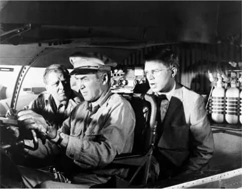Richard Attenborough - Richard Attenborough, James Stewart &amp; Hardy Krüger in American drama film The Flight of the Phoenix (1965). See also film still. No copyright notice.