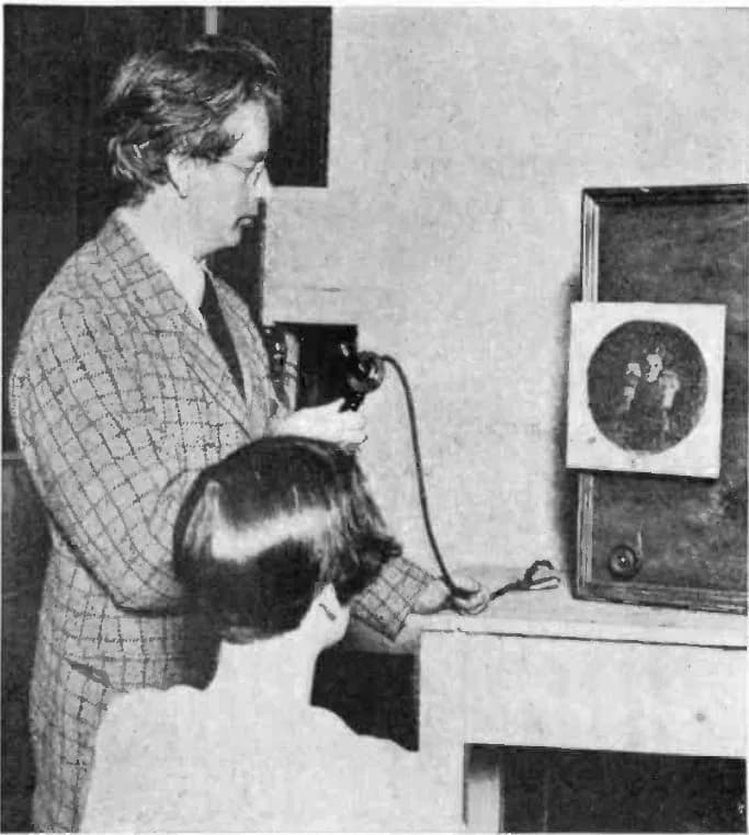 John Logie Baird - Scottish television pioneer John Logie Baird (left) and his television receiver.  This was one of the world's first television systems,  with which Baird demonstrated transmission o