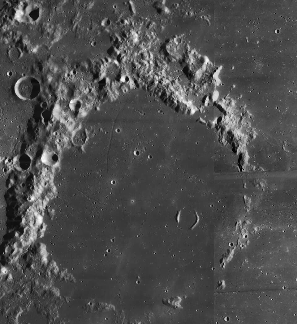 Arthur Eddington - Eddington, on the moon.  Mosaic of two Lunar Orbiter 4 images.  The gray band at right is an artifact of the original image.