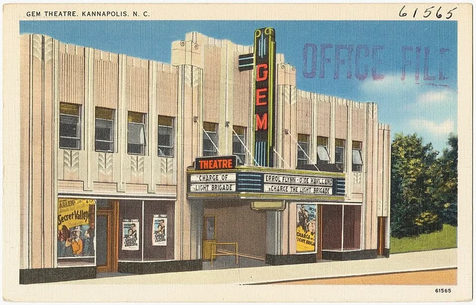 Errol Flynn - File name: 06_10_016078
Title: Gem Theatre, Kannapolis, N. C.
Created/Published: Pub. by Dixie News Company, Charlotte, N.C.; Tichnor Bros. Inc., Boston, Mass.
Date issued: 1930 - 1945 (
