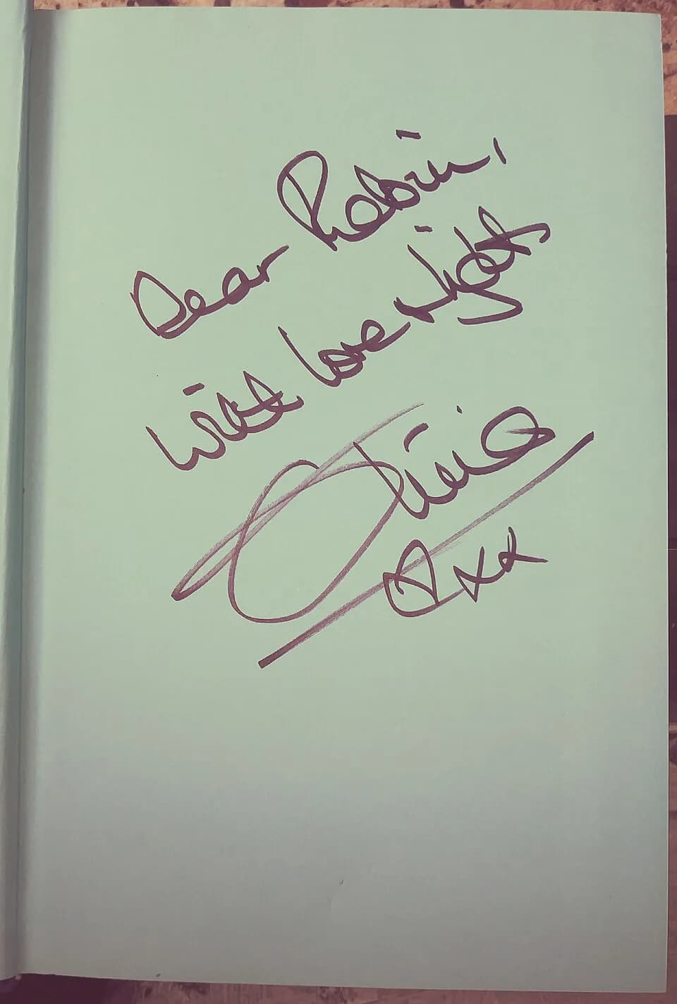 Olivia Newton-John - Olivia Newton-John's signature in a copy of her book Don't Stop Believing: "Dear Robin, with love &amp; light Olivia xxx"; there is also this cropped version: